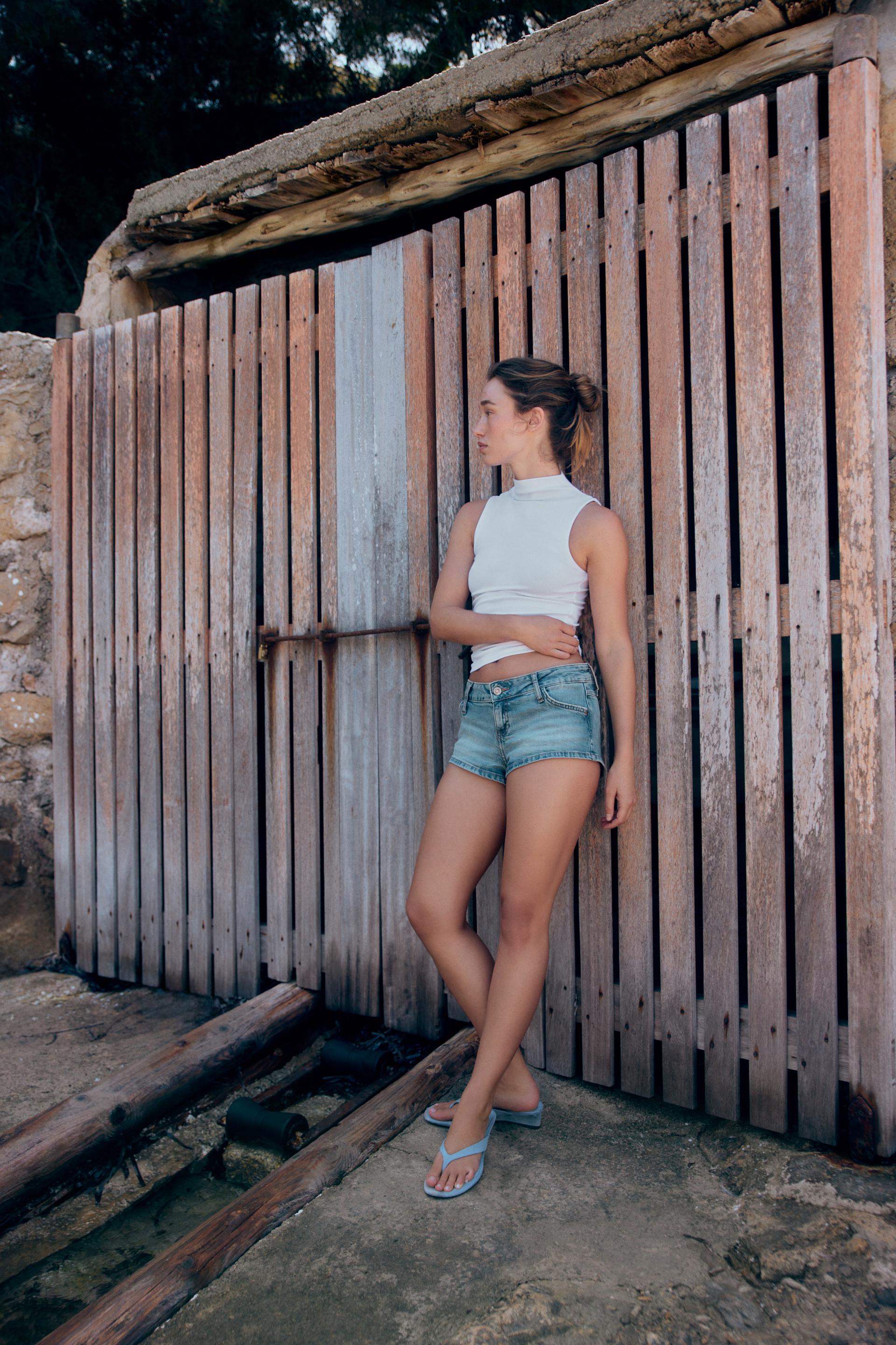 The Muse White Sleeveless Mock Neck Top