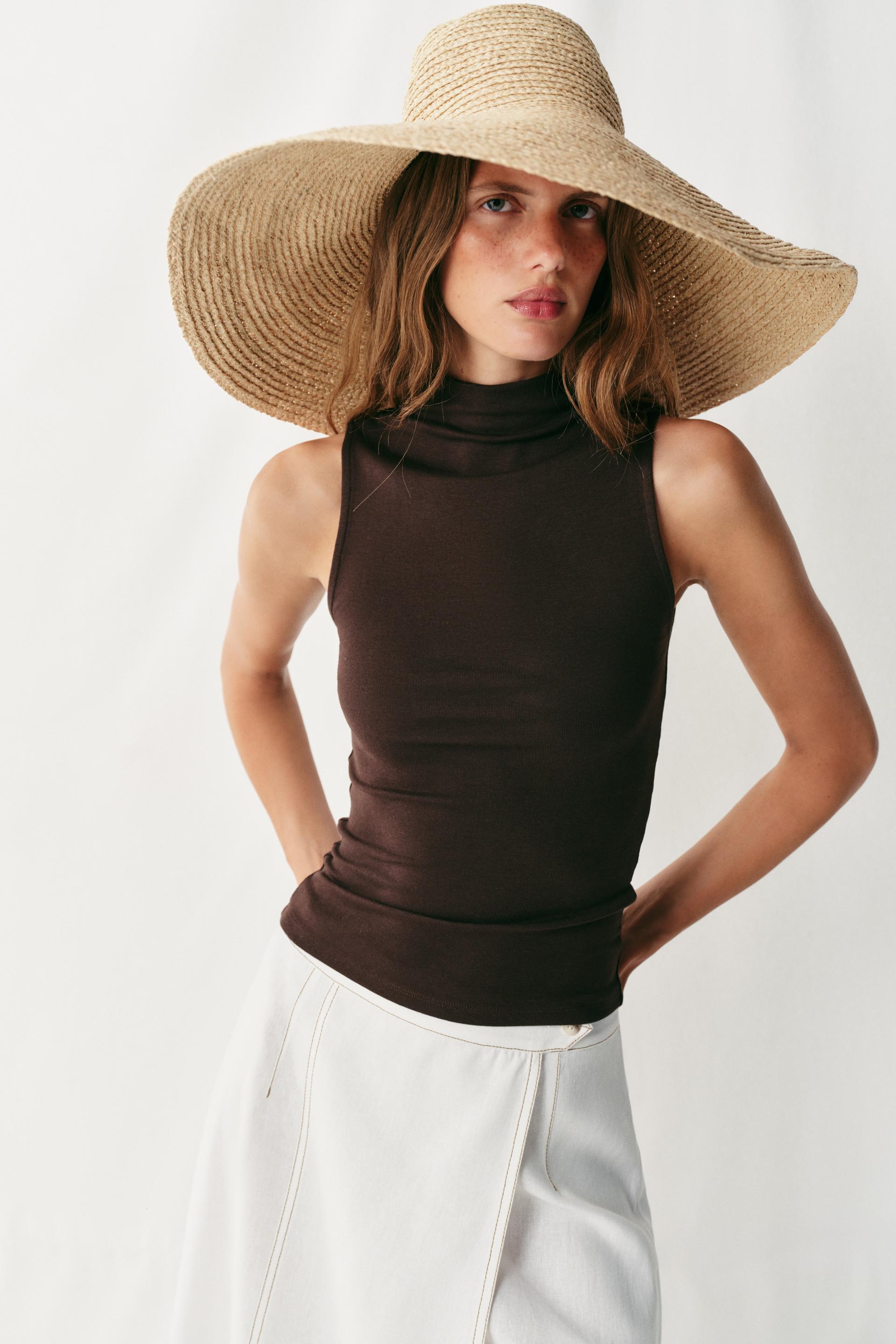 The Muse Ivory Sleeveless Mock Neck Top