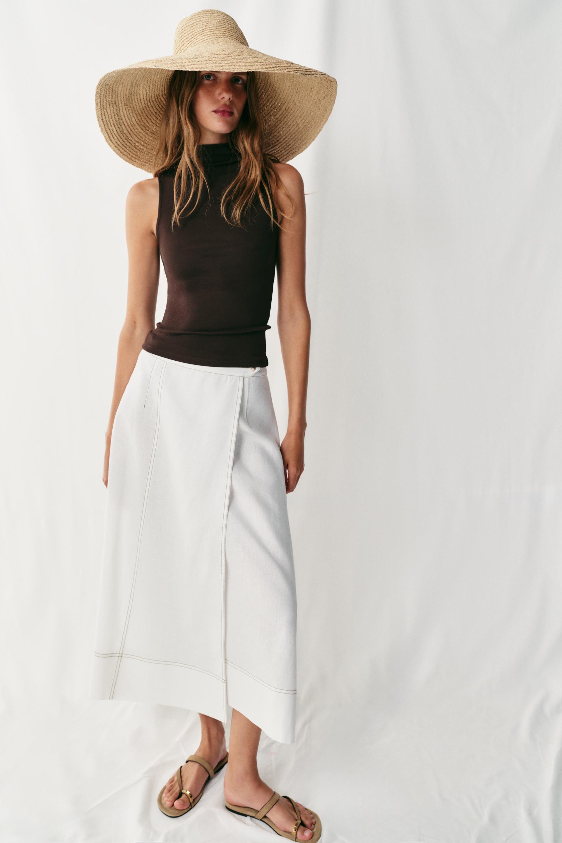 The Muse Ivory Sleeveless Mock Neck Top