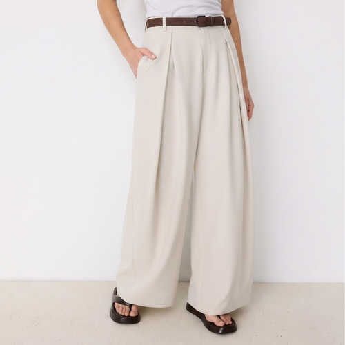 Women's beige maxi darted trousers with fluid wide leg and sculptural front drape by STATE OF HER