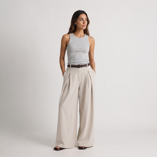 Women's beige maxi darted trousers with fluid wide leg and sculptural front drape by STATE OF HER