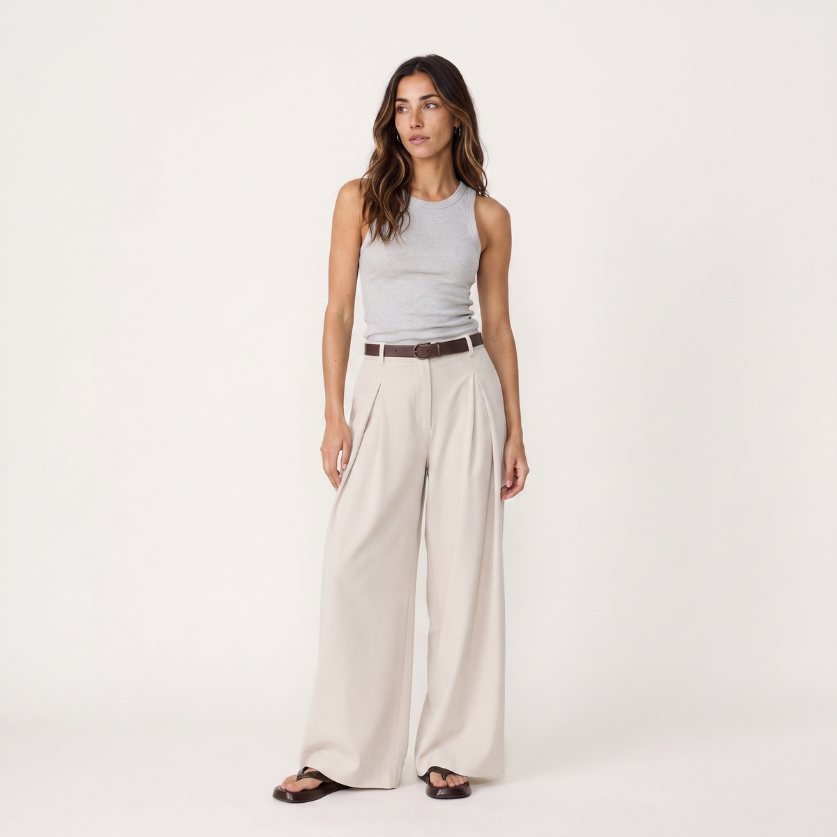Women's beige maxi darted trousers with fluid wide leg and sculptural front drape by STATE OF HER