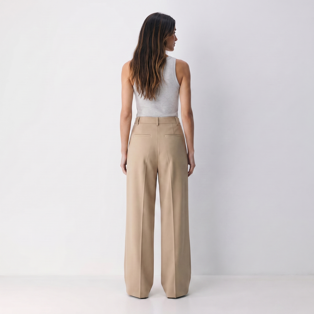 Women's beige wide-leg tailored trousers with double front pleats and fluid drape by STATE OF HER