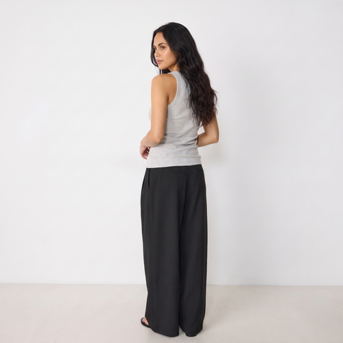 Women's black maxi darted trousers with fluid wide leg and sculptural front drape by STATE OF HER