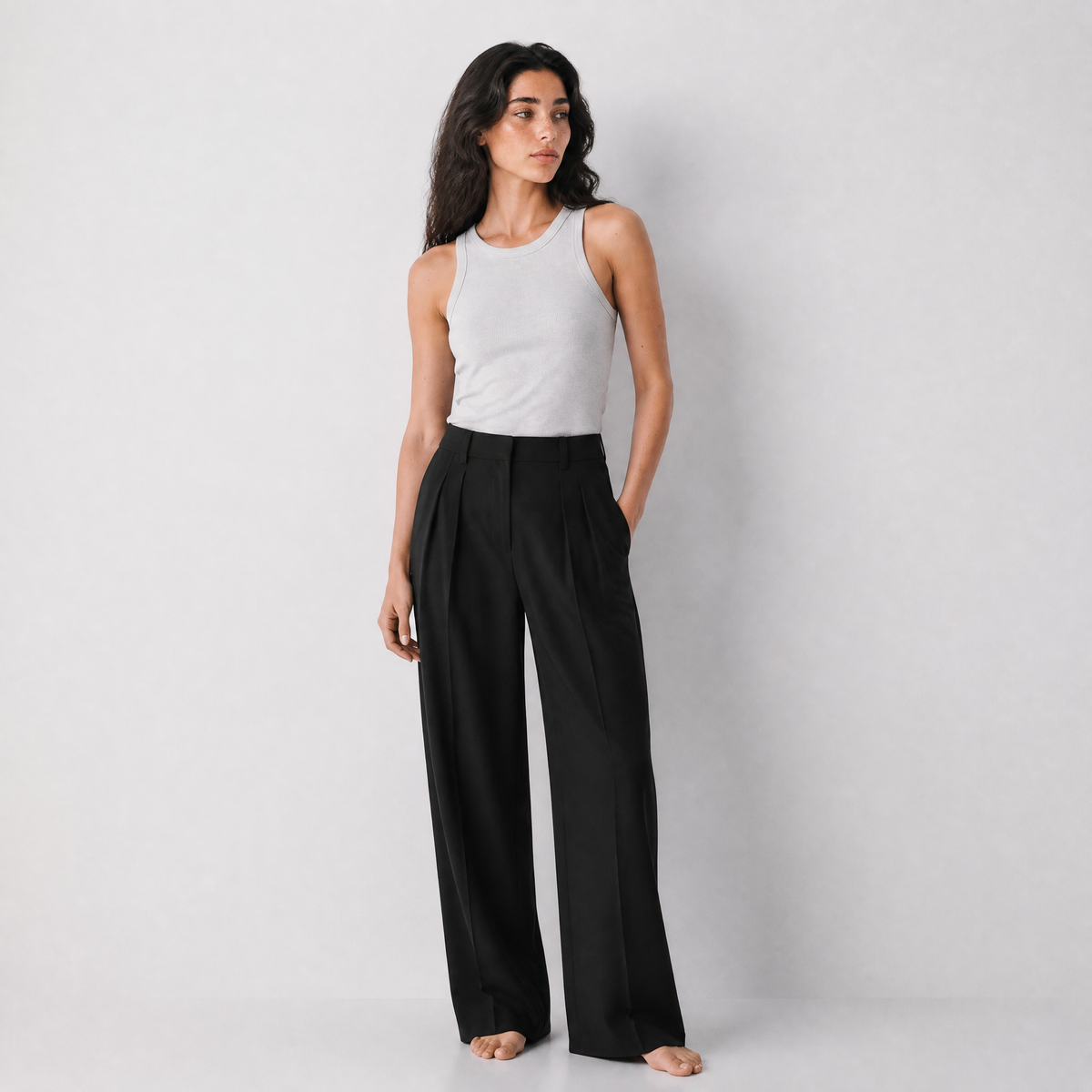 Women's black wide-leg tailored trousers with double front pleats and fluid drape by STATE OF HER