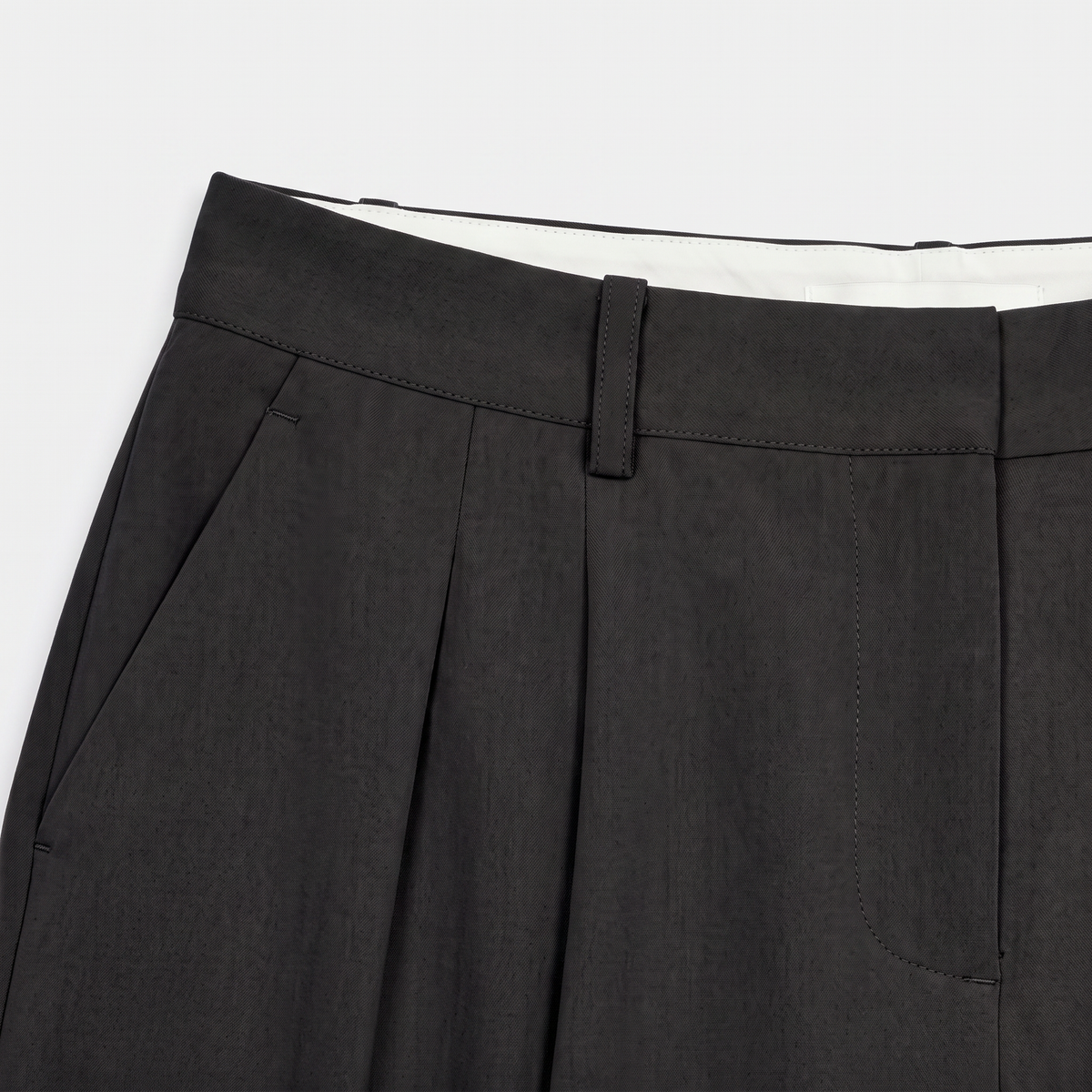 Women's black wide-leg tailored trousers with double front pleats and fluid drape by STATE OF HER