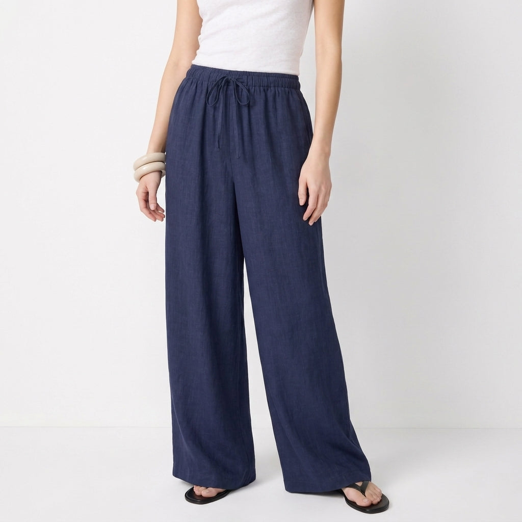 Women's blue linen straight-leg trousers with relaxed fit and pockets by STATE OF HER
