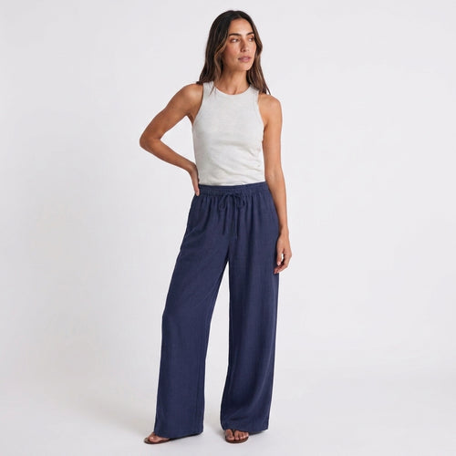 Women's blue linen straight-leg trousers with relaxed fit and pockets by STATE OF HER