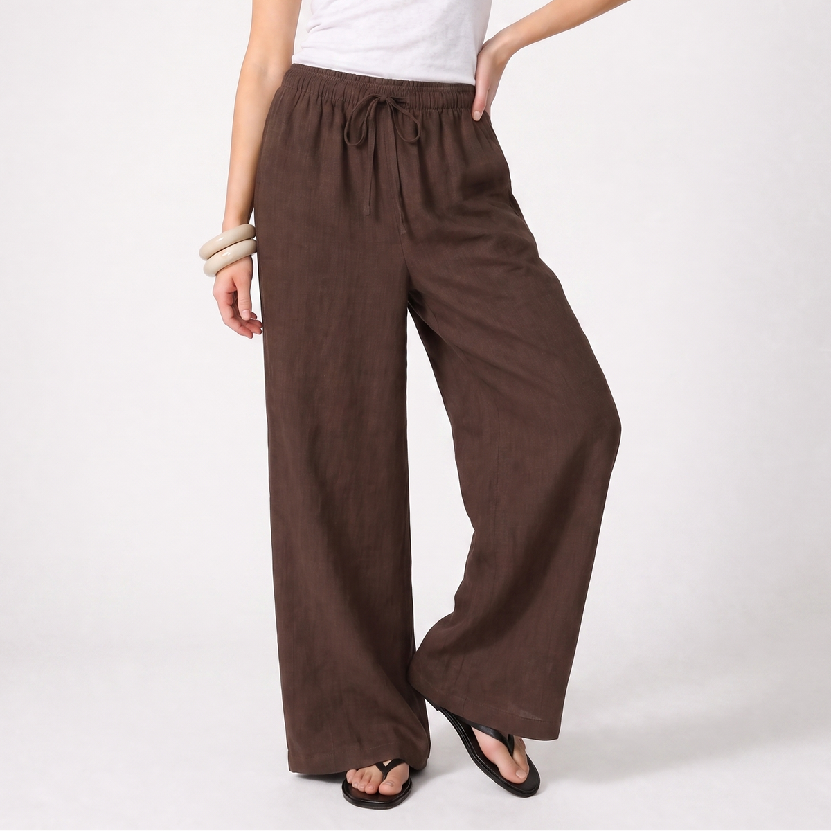 Women's brown linen straight-leg trousers with relaxed fit and pockets by STATE OF HER