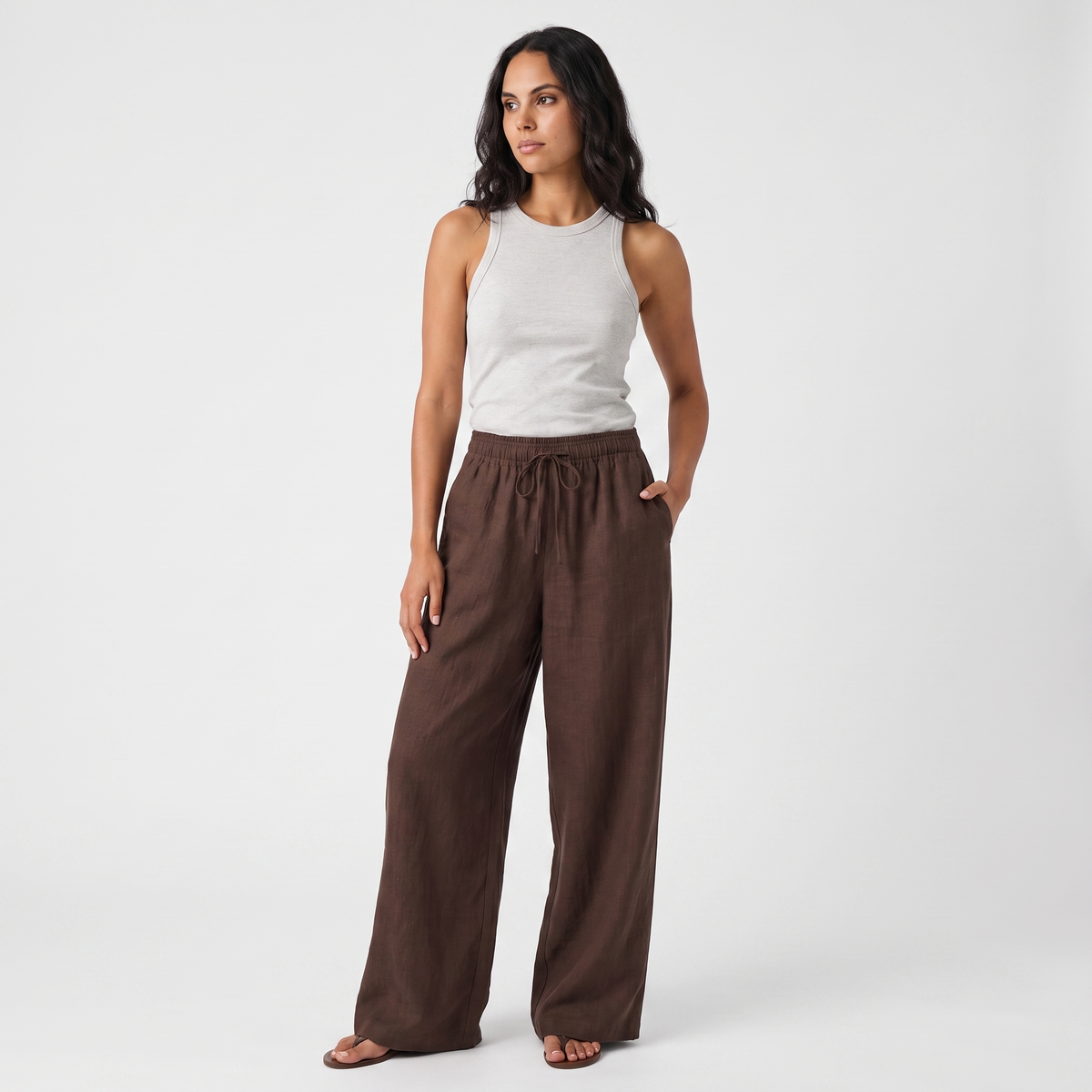 Women's brown linen straight-leg trousers with relaxed fit and pockets by STATE OF HER