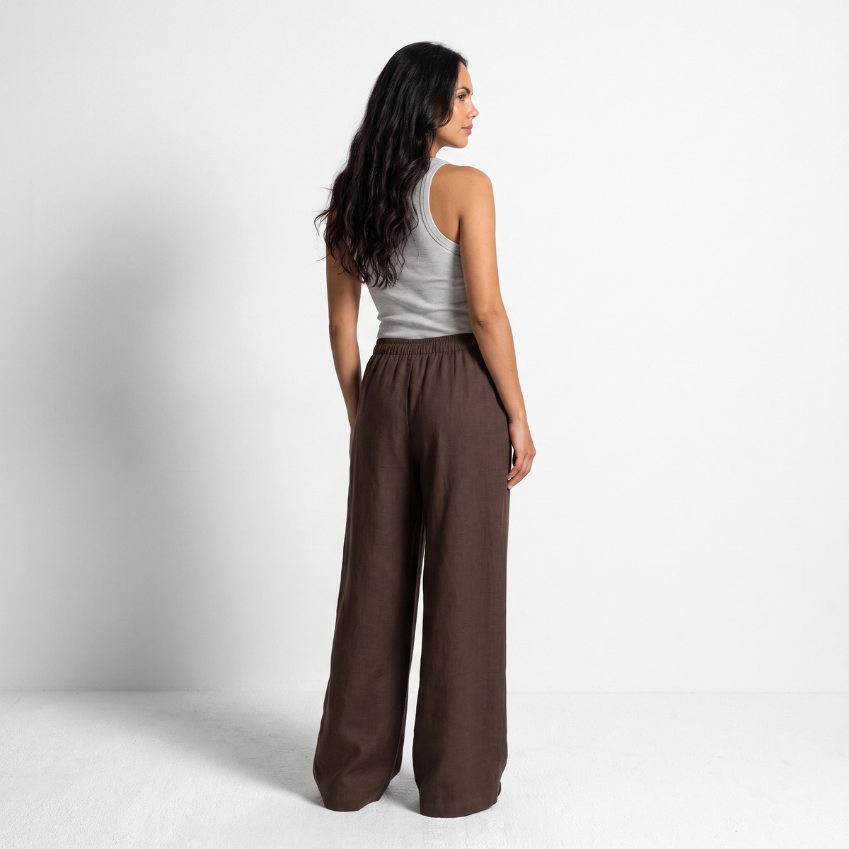 Women's brown linen straight-leg trousers with relaxed fit and pockets by STATE OF HER