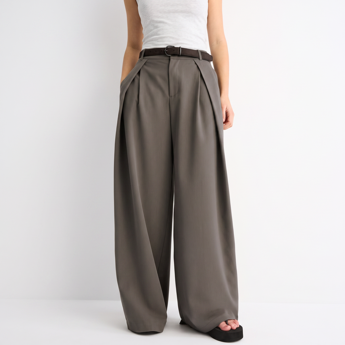 Women's brown maxi darted trousers with fluid wide leg and sculptural front drape by STATE OF HER