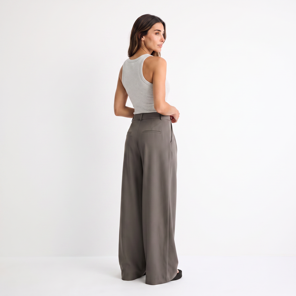 Women's brown maxi darted trousers with fluid wide leg and sculptural front drape by STATE OF HER