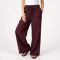 Women's burgundy linen straight-leg trousers with relaxed fit and pockets by STATE OF HER