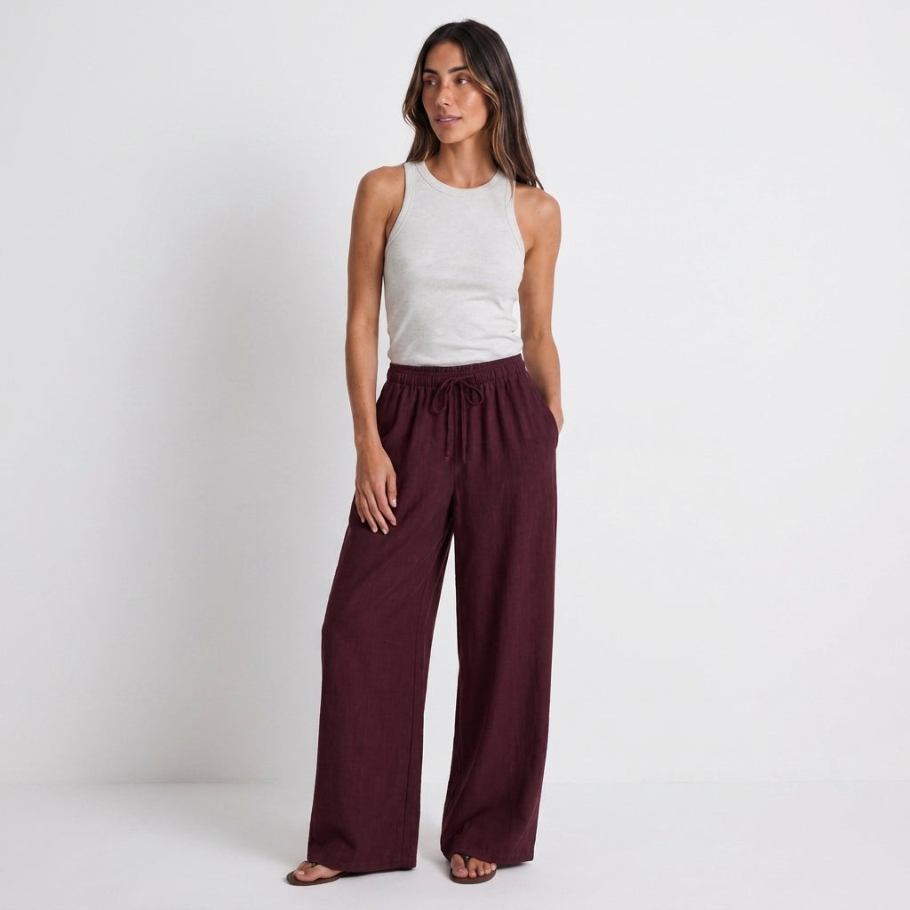 Women's burgundy linen straight-leg trousers with relaxed fit and pockets by STATE OF HER