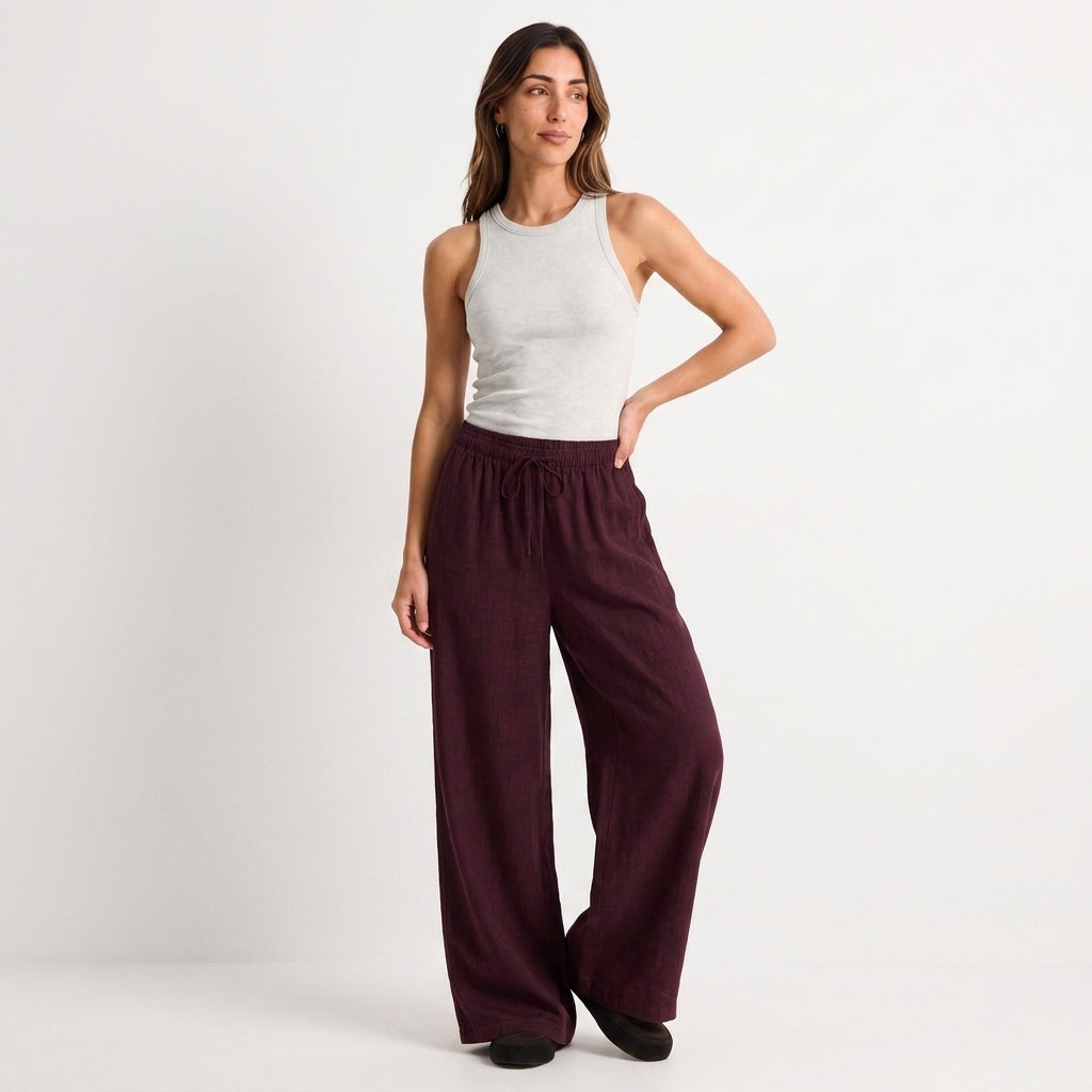 Women's burgundy linen straight-leg trousers with relaxed fit and pockets by STATE OF HER