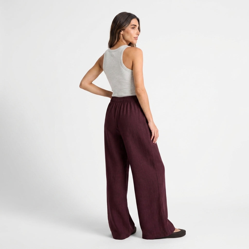 Women's burgundy linen straight-leg trousers with relaxed fit and pockets by STATE OF HER