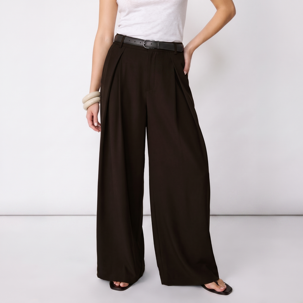 Women's dark brown maxi darted trousers with fluid wide leg and sculptural front drape by STATE OF HER
