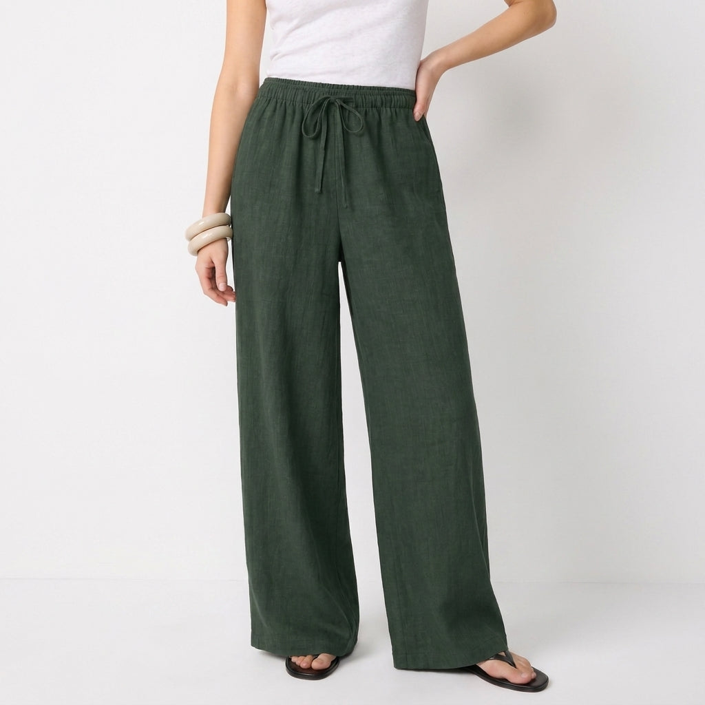 Women's green linen straight-leg trousers with relaxed fit and pockets by STATE OF HER