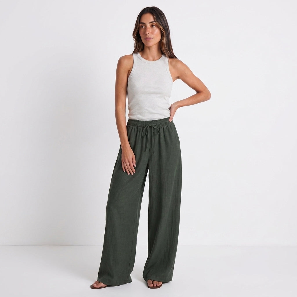 Women's green linen straight-leg trousers with relaxed fit and pockets by STATE OF HER
