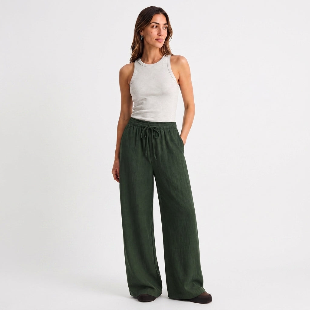 Women's green linen straight-leg trousers with relaxed fit and pockets by STATE OF HER