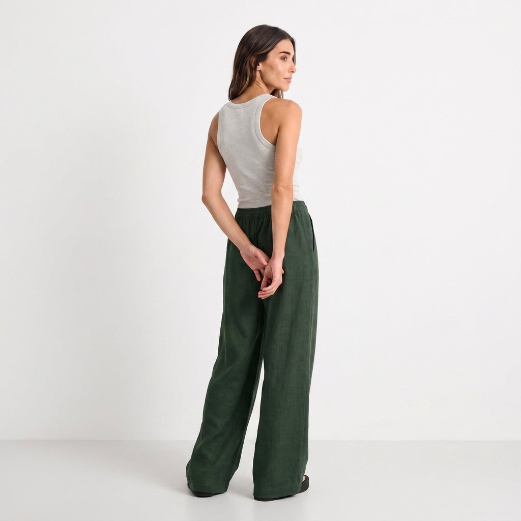 Women's green linen straight-leg trousers with relaxed fit and pockets by STATE OF HER
