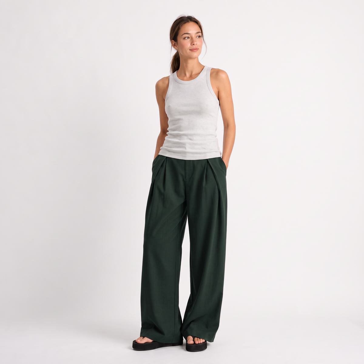 Women's green maxi darted trousers with fluid wide leg and sculptural front drape by STATE OF HER