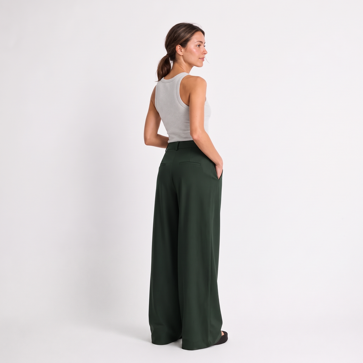 Women's green maxi darted trousers with fluid wide leg and sculptural front drape by STATE OF HER