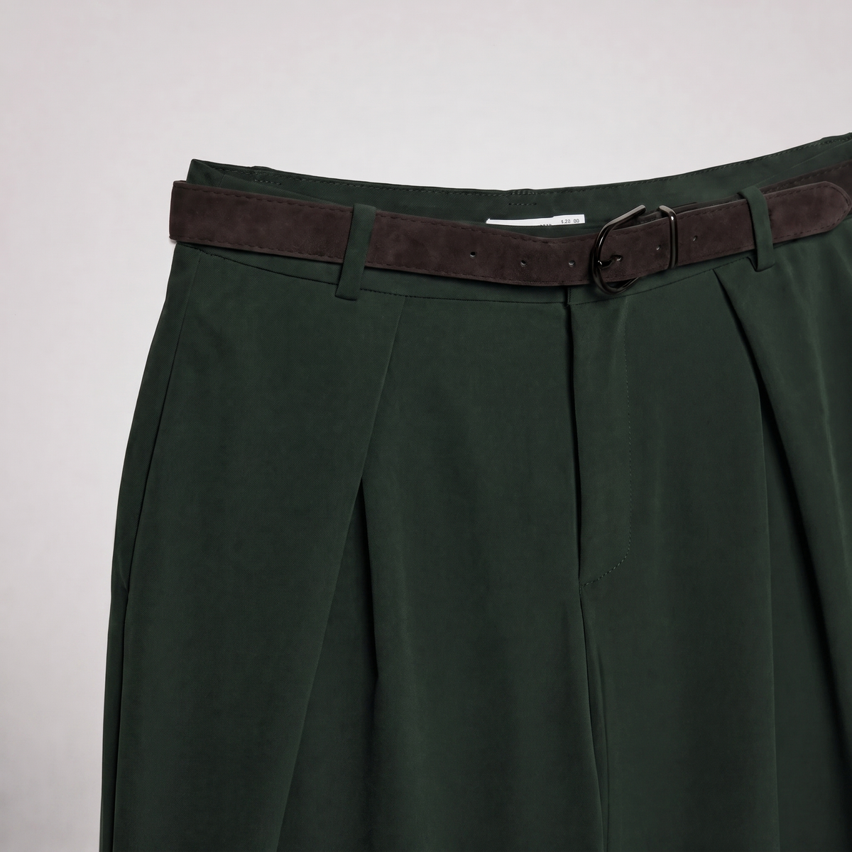 Women's green maxi darted trousers with fluid wide leg and sculptural front drape by STATE OF HER