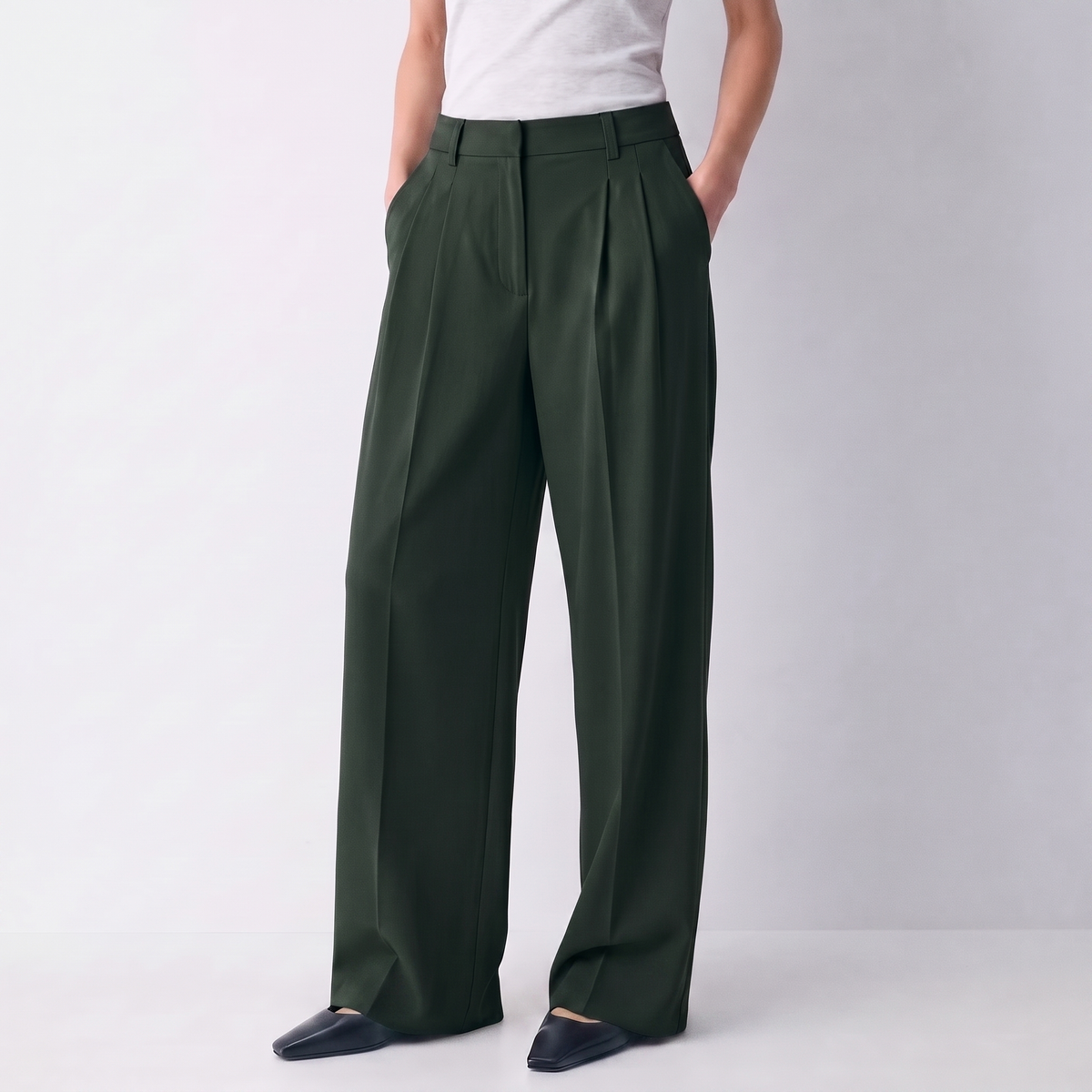 Women's green wide-leg tailored trousers with double front pleats and fluid drape by STATE OF HER