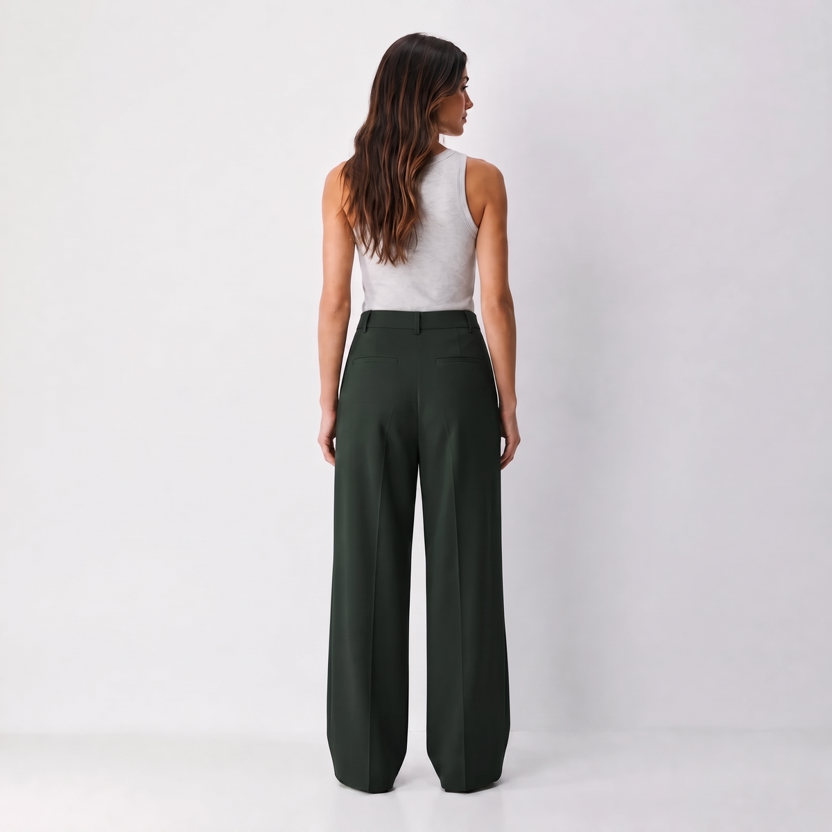 Women's green wide-leg tailored trousers with double front pleats and fluid drape by STATE OF HER