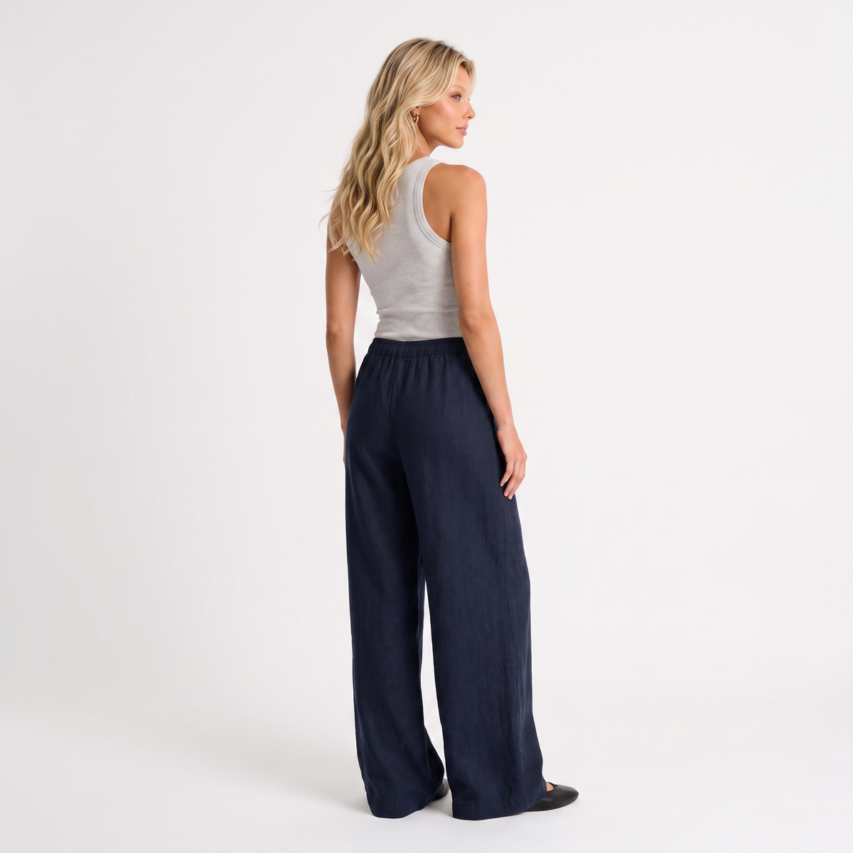 Women's navy linen straight-leg trousers with relaxed fit and pockets by STATE OF HER