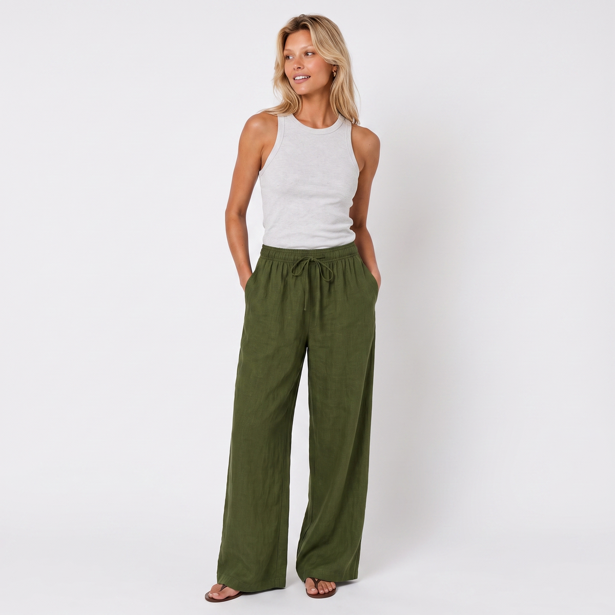 Women's olive linen straight-leg trousers with relaxed fit and pockets by STATE OF HER