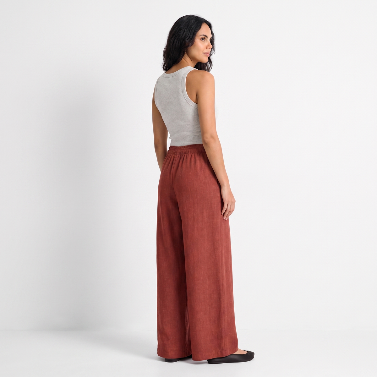 Women's orange red linen straight-leg trousers with relaxed fit and pockets by STATE OF HER